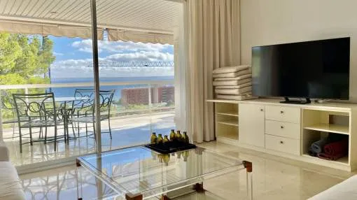 Exclusive apartment in Cas Català with breathtaking sea views, a communal swimming pool, and a spacious terrace